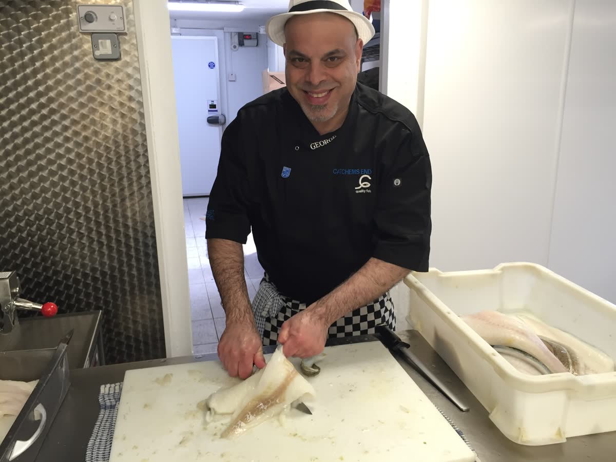 George Georgiou preparing fresh fish in the Catchems End kitchen